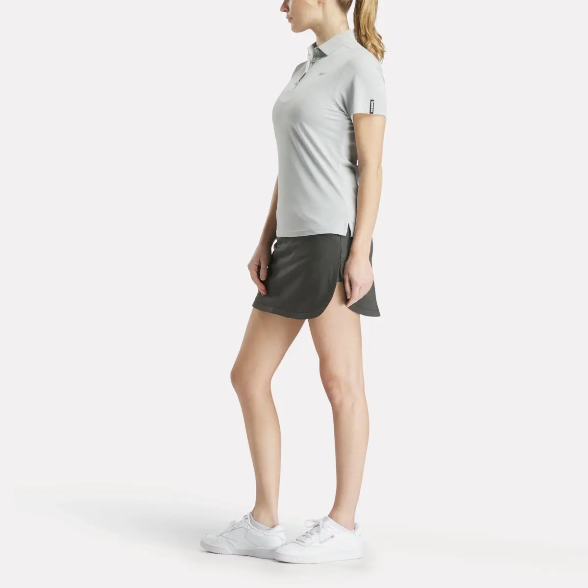 Polo à manches courtes et empiècement en piqué extensible pour femmes Polo à manches courtes et empiècement en piqué extensible pour femmes